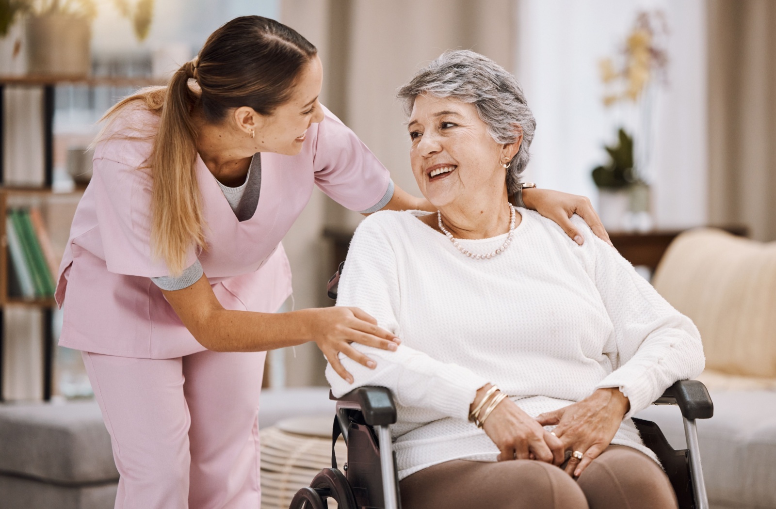 A care staff connects with a resident during their rehabilitation plan.